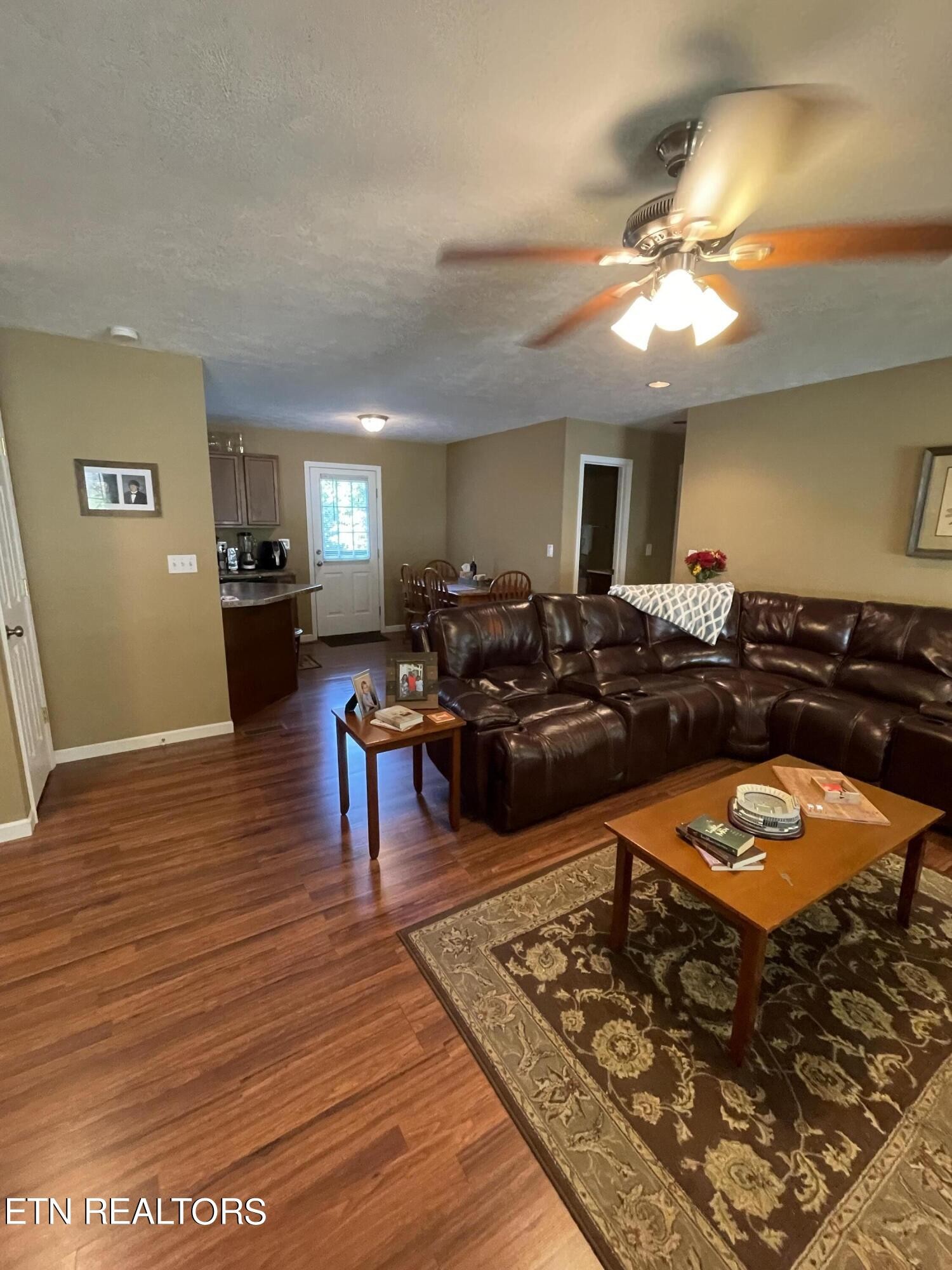 421 Delaware Avenue Oak Ridge, TN 37830 - Photo 12 of 34 a living room with furniture and a wooden floor
