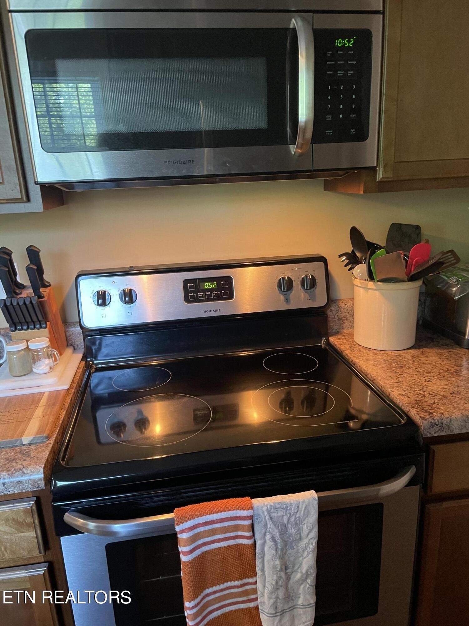 421 Delaware Avenue Oak Ridge, TN 37830 - Photo 18 of 34 a stove top oven sitting inside of a kitchen