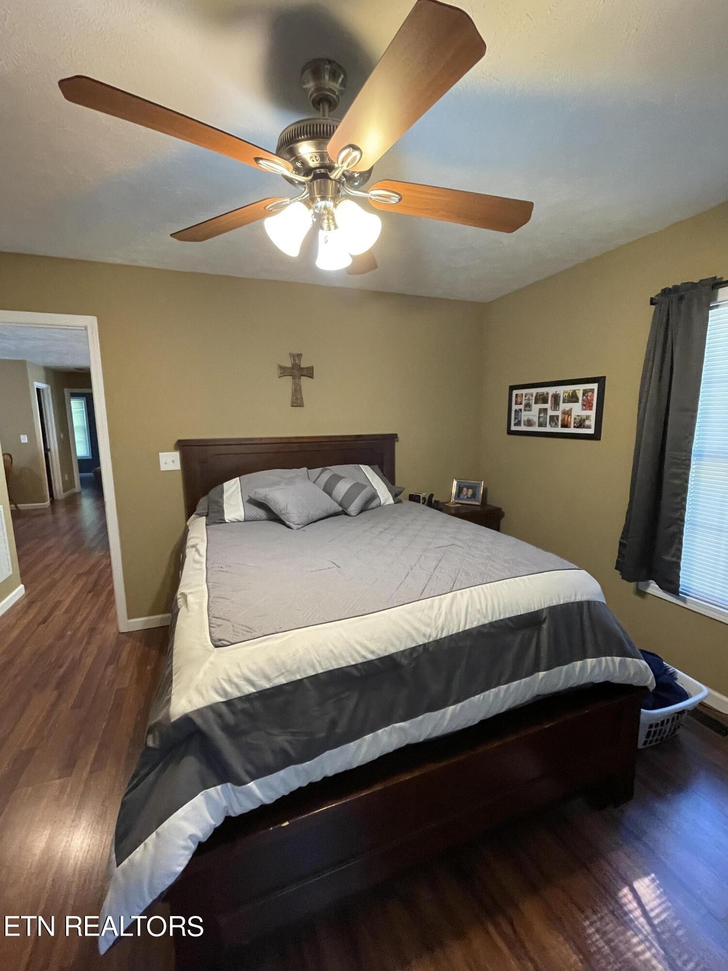 421 Delaware Avenue Oak Ridge, TN 37830 - Photo 24 of 34 a bedroom with a bed and wooden floor