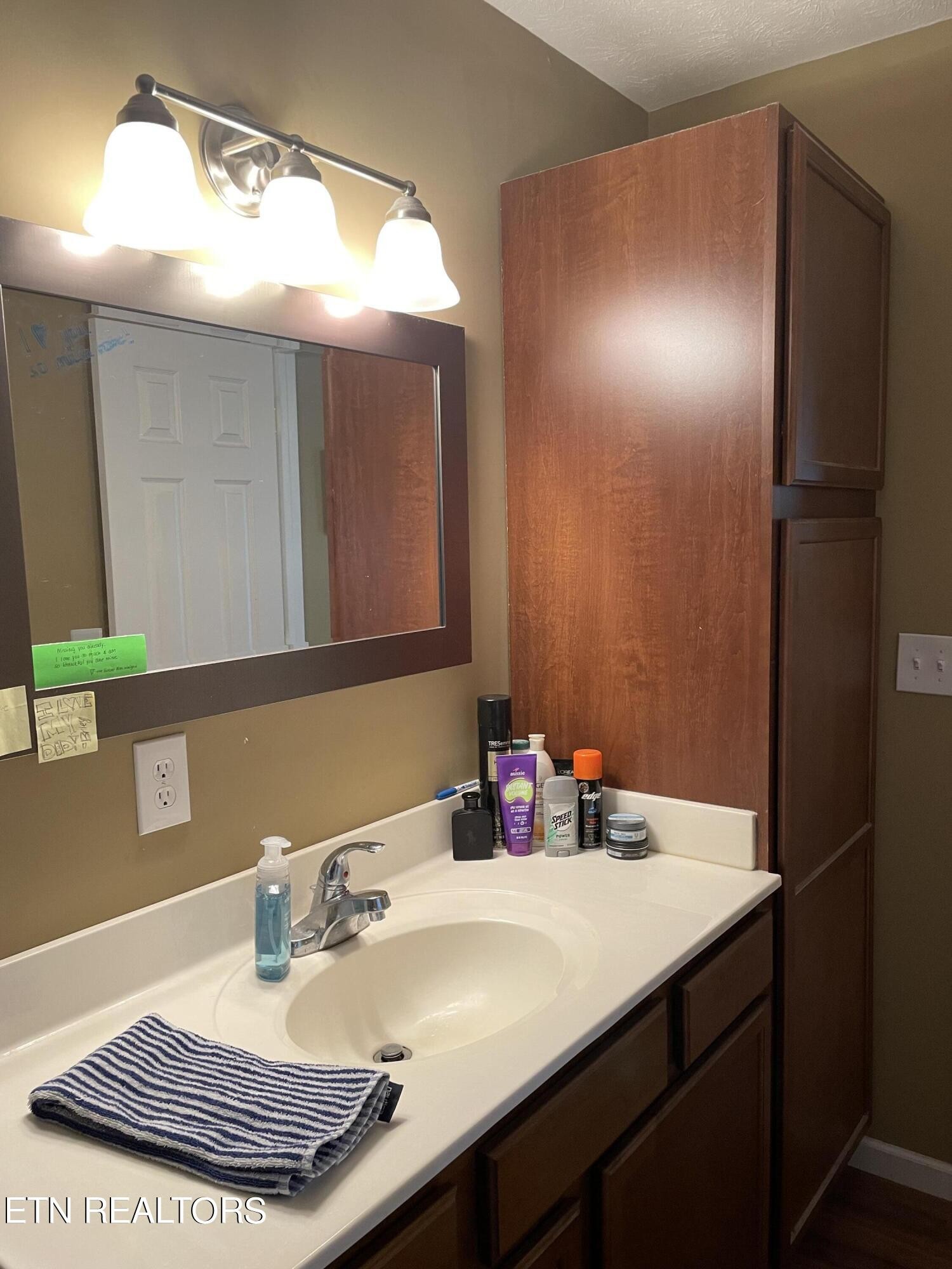 421 Delaware Avenue Oak Ridge, TN 37830 - Photo 29 of 34 a bathroom with a sink and a mirror