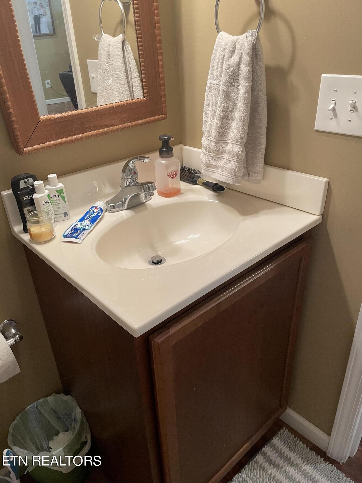 421 Delaware Avenue Oak Ridge, TN 37830 - Photo 31 of 34 a bathroom with a sink and a mirror