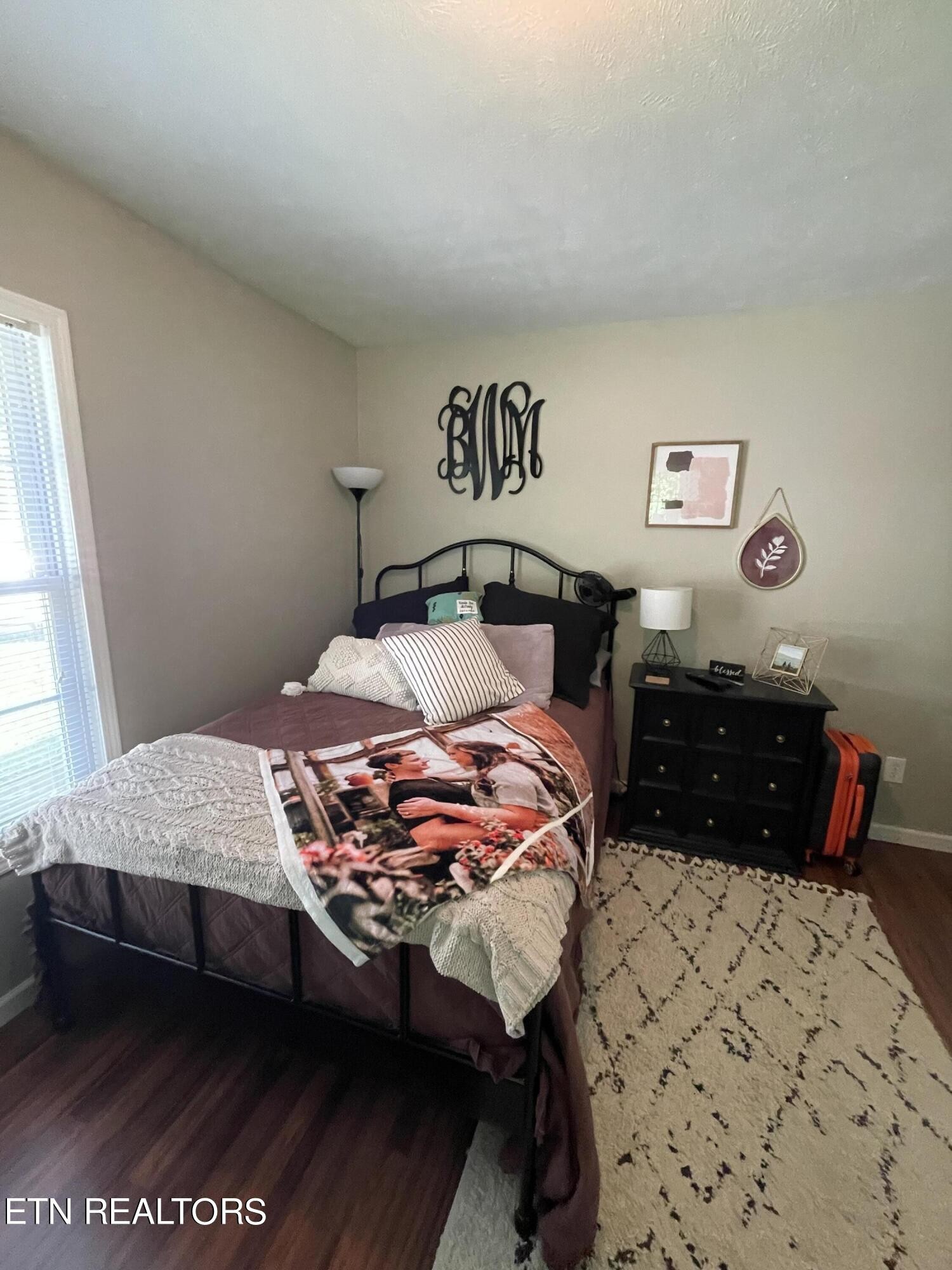 421 Delaware Avenue Oak Ridge, TN 37830 - Photo 32 of 34 a bedroom with a bed and a lamp on dresser