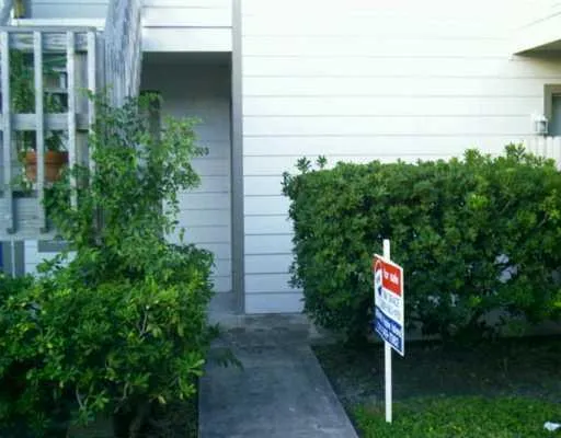 a sign that is on the side of a house