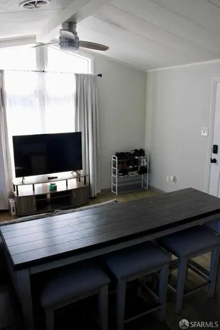 a room with a table and chairs