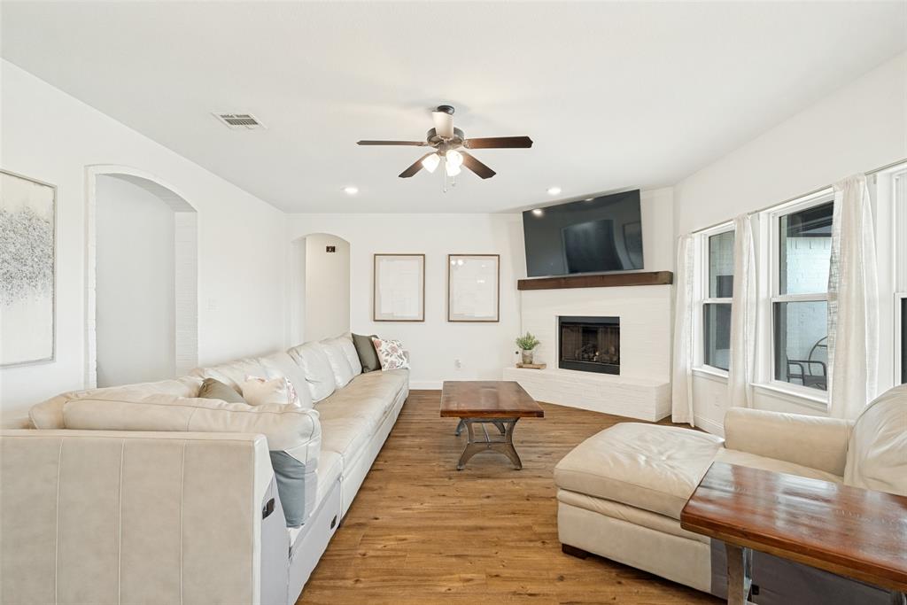 9424 Wildcat Ridge Godley, TX 76044 - Photo 5 of 25 a living room with furniture fireplace and flat screen tv