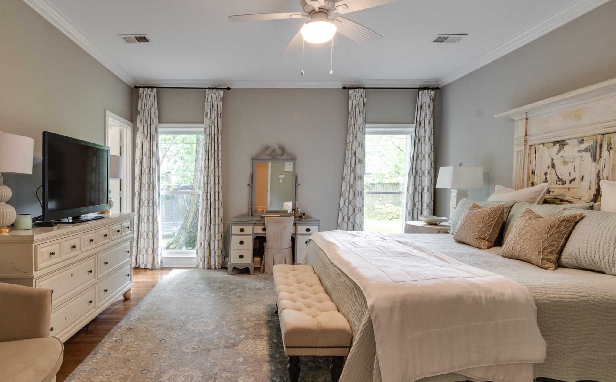 102 Fernway Road Memphis, TN 38117 - Photo 12 of 26 a bedroom with a bed and a flat screen tv on dresser