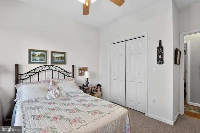 a large white bed in a white room