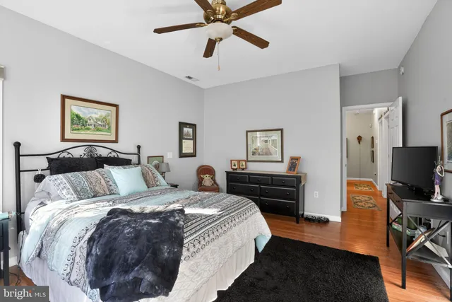 a bathroom with a tub a sink and a mirror