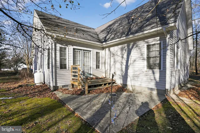 a backyard of a house with outdoor seating