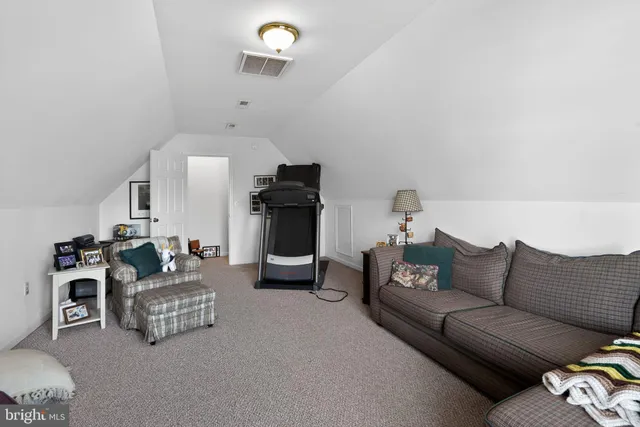 a living room with furniture and a couch