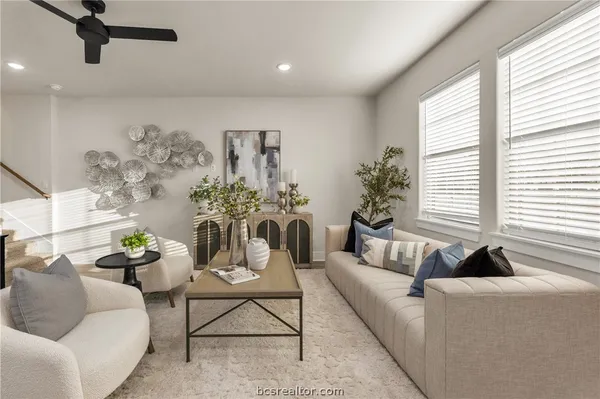 a living room with furniture and a large window