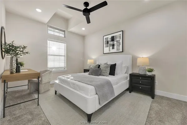 a bedroom with a bed and window