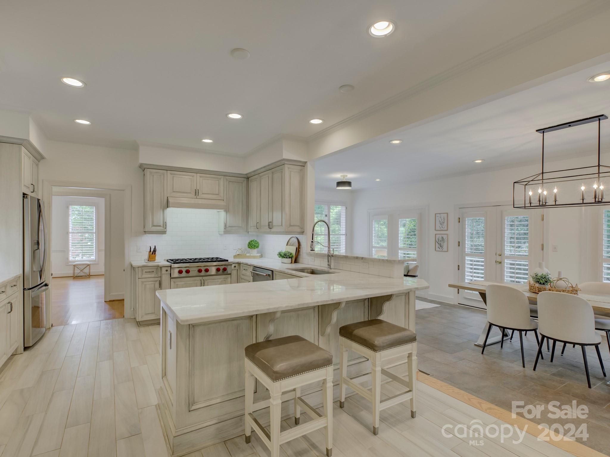 4440 Canoebrook Road Charlotte, NC 28210 - Photo 12 of 47 a large kitchen with a table and chairs