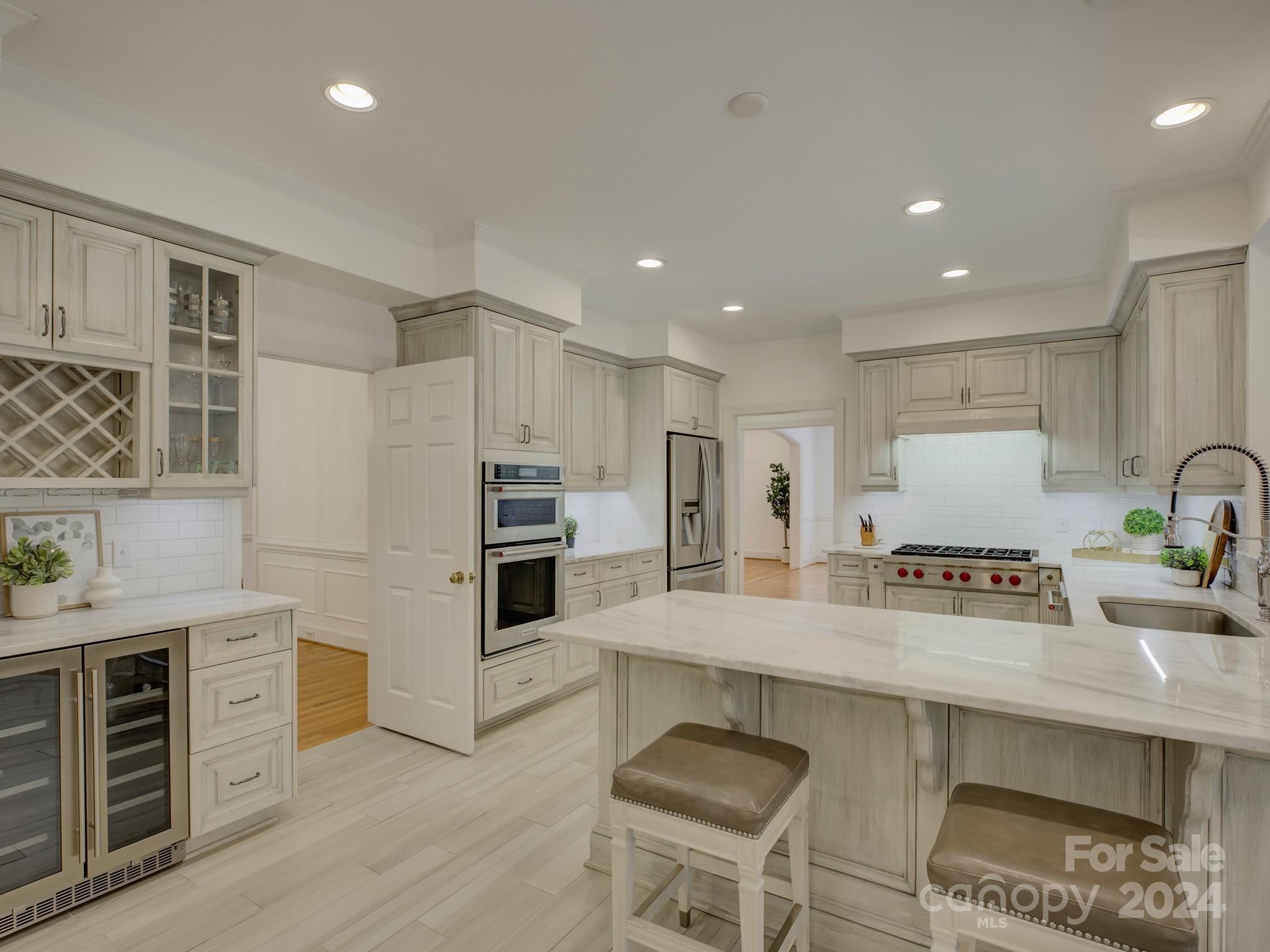 4440 Canoebrook Road Charlotte, NC 28210 - Photo 13 of 47 a kitchen with stainless steel appliances granite countertop a sink counter space and cabinets
