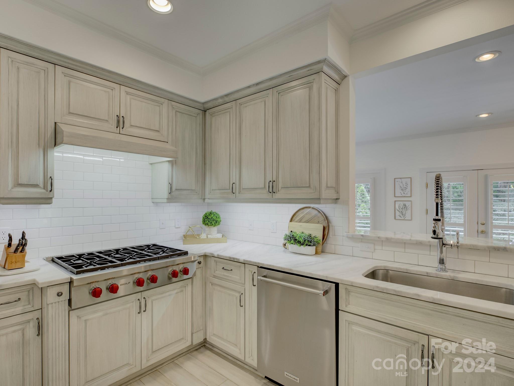 4440 Canoebrook Road Charlotte, NC 28210 - Photo 15 of 47 a kitchen with stainless steel appliances a sink stove and cabinets