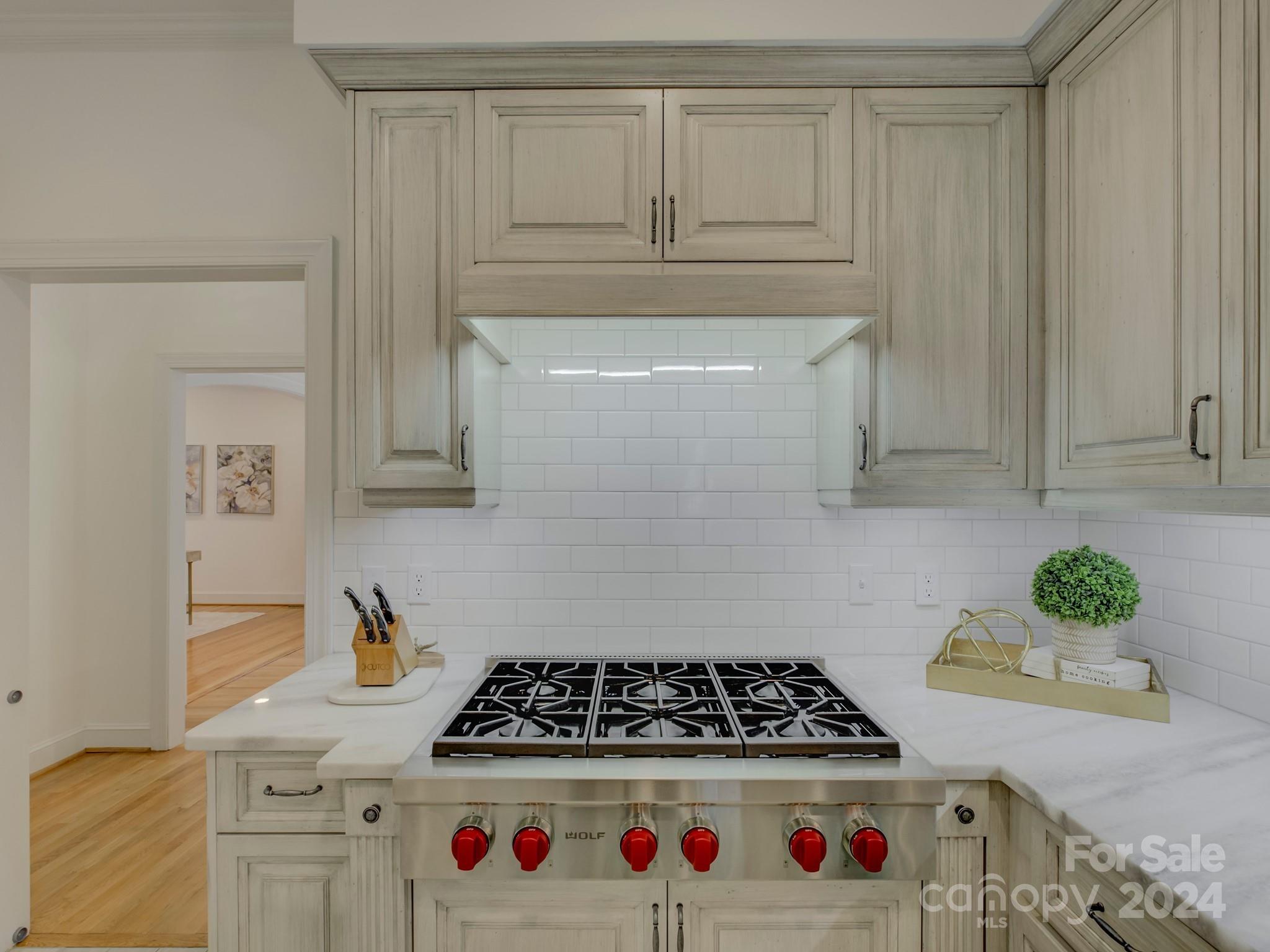 4440 Canoebrook Road Charlotte, NC 28210 - Photo 16 of 47 a kitchen with white cabinets and appliances