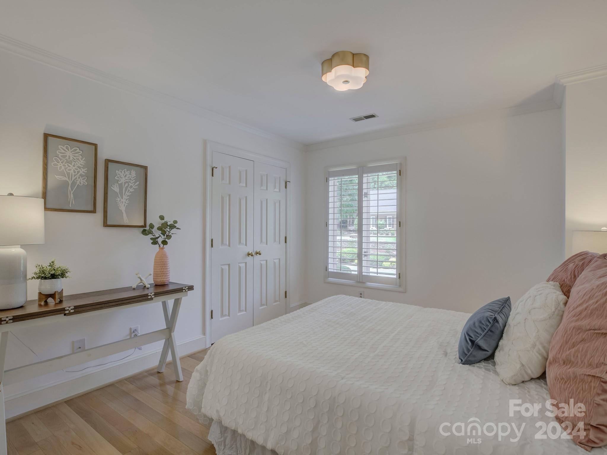 4440 Canoebrook Road Charlotte, NC 28210 - Photo 31 of 47 a bedroom with a bed and a window