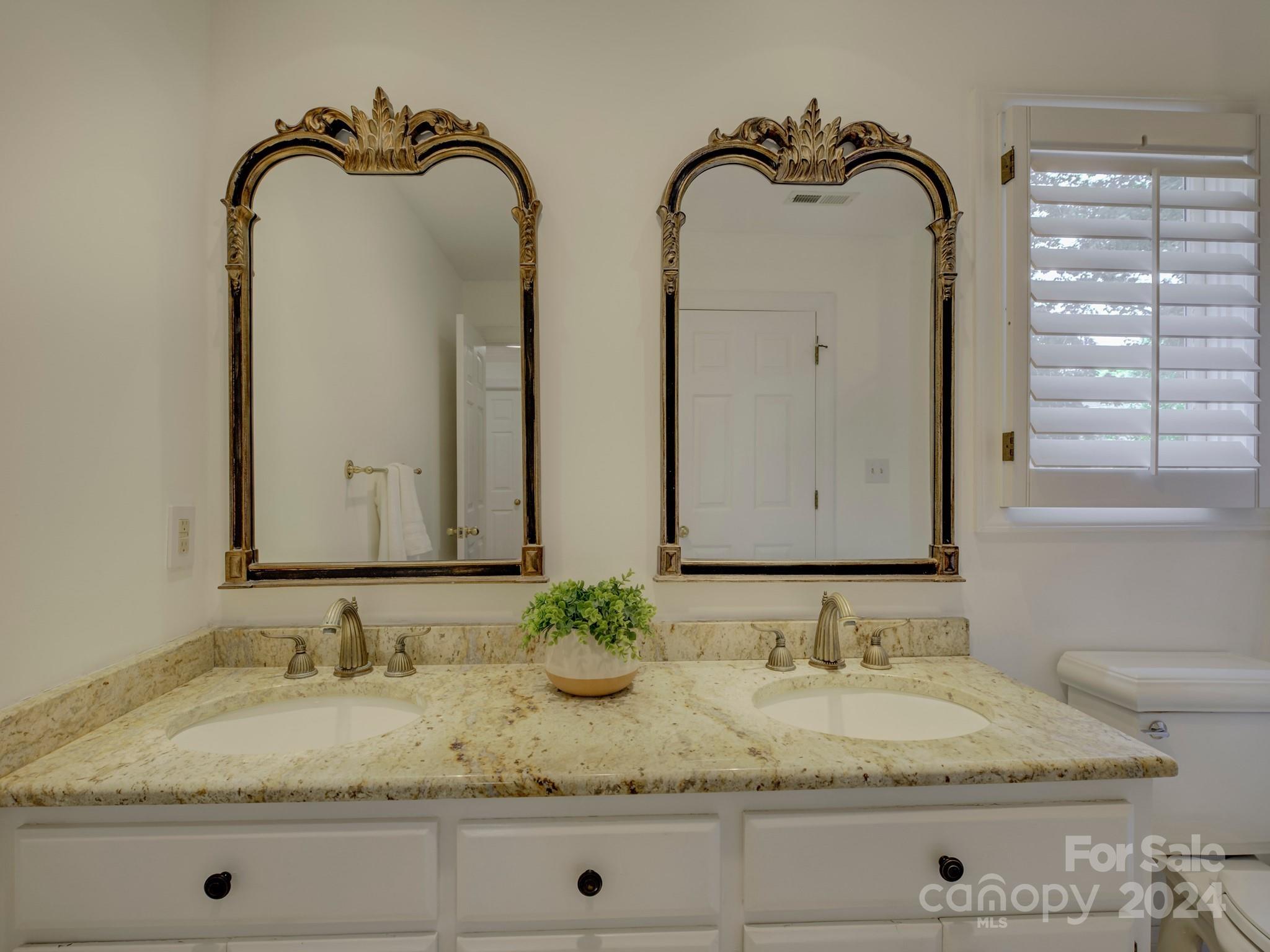 4440 Canoebrook Road Charlotte, NC 28210 - Photo 32 of 47 a bathroom with a granite countertop sink and a mirror
