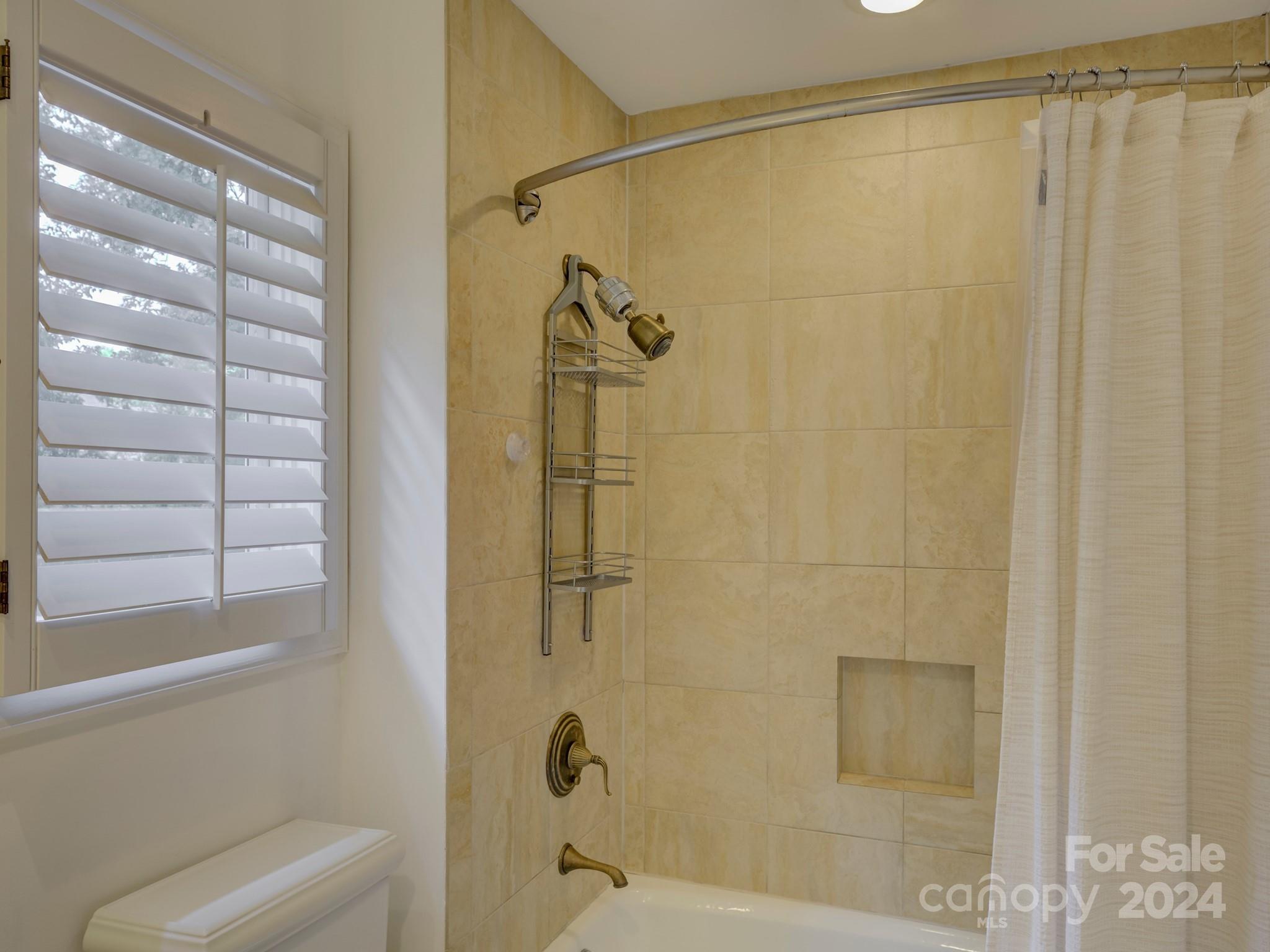 4440 Canoebrook Road Charlotte, NC 28210 - Photo 33 of 47 a bathroom with a shower and a toilet