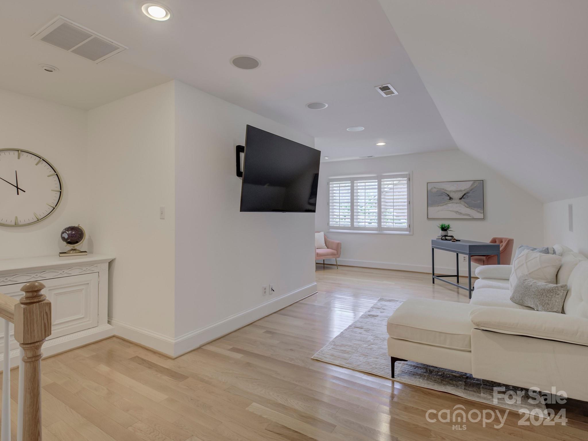 4440 Canoebrook Road Charlotte, NC 28210 - Photo 35 of 47 a living room with furniture and a flat screen tv