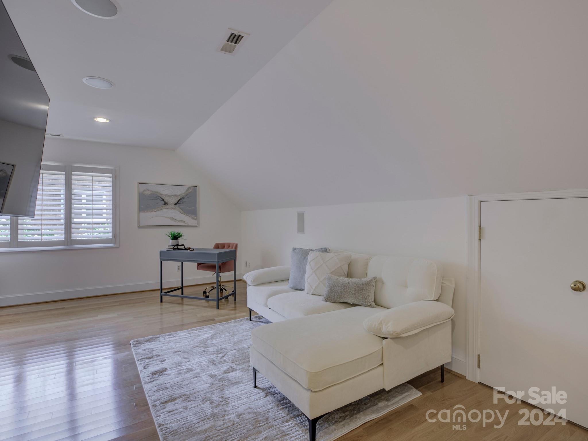 4440 Canoebrook Road Charlotte, NC 28210 - Photo 36 of 47 a living room with furniture and a rug