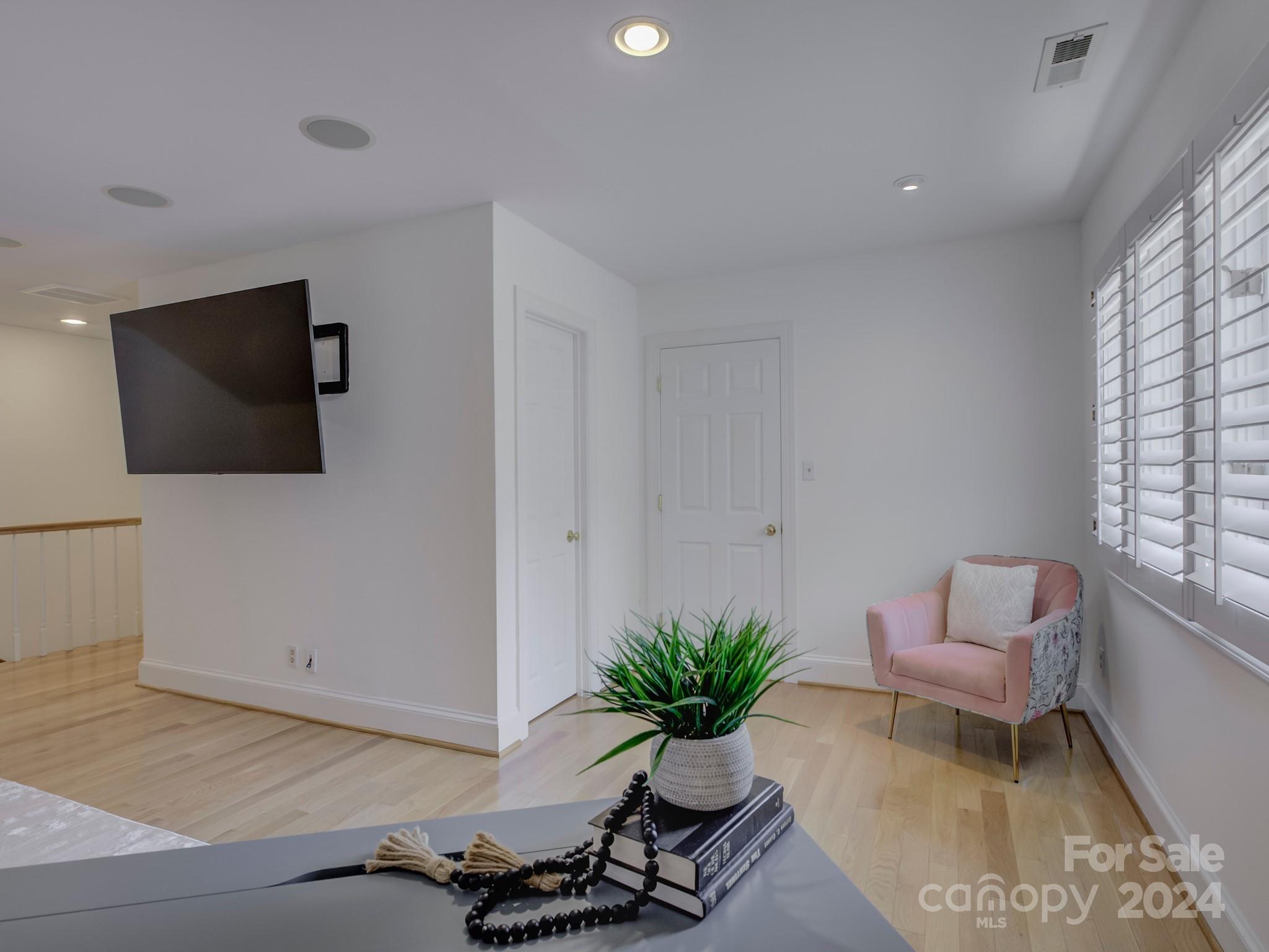 4440 Canoebrook Road Charlotte, NC 28210 - Photo 37 of 47 a living room with furniture and a flat screen tv