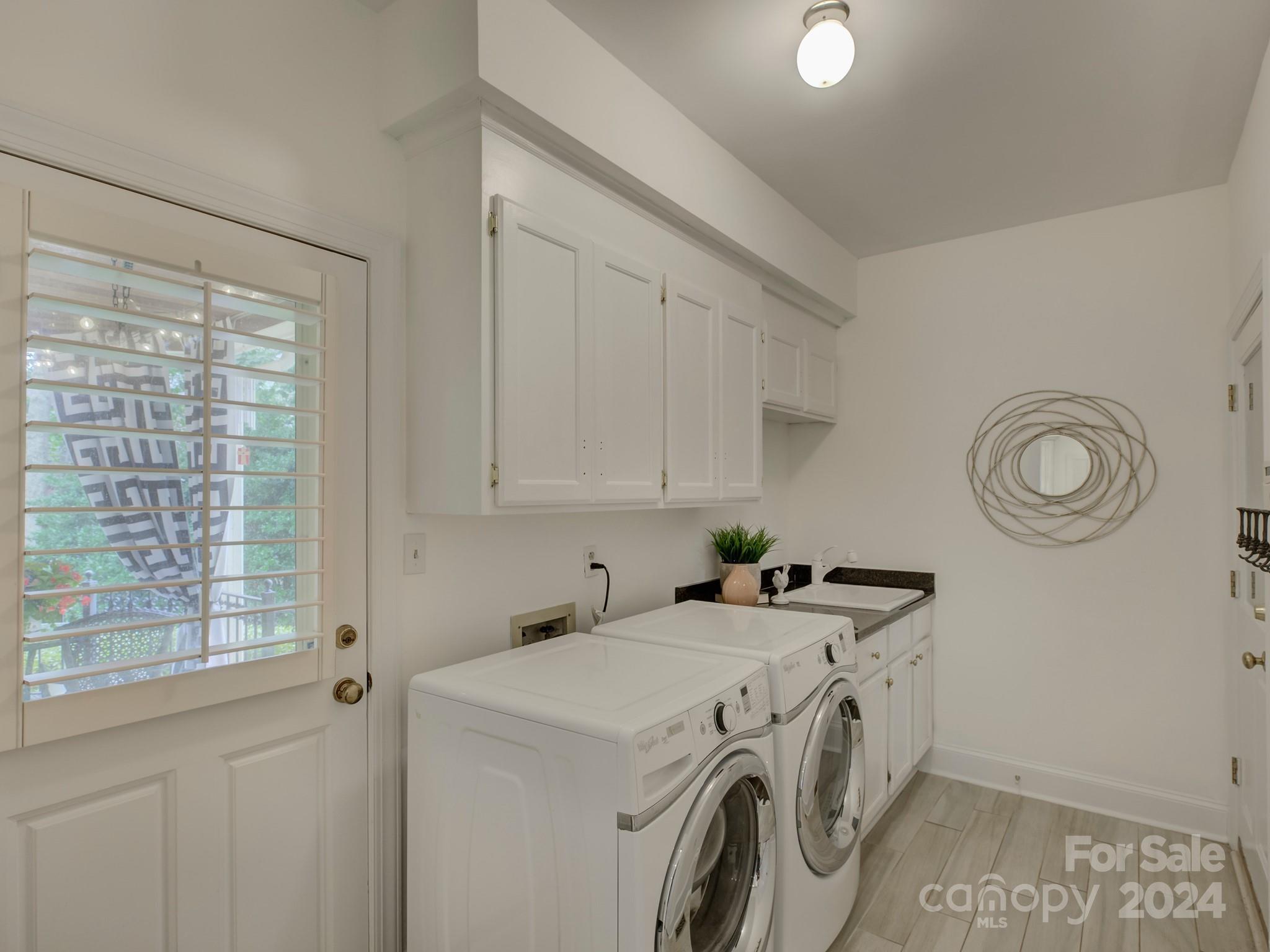 4440 Canoebrook Road Charlotte, NC 28210 - Photo 39 of 47 a utility room with dryer and washer