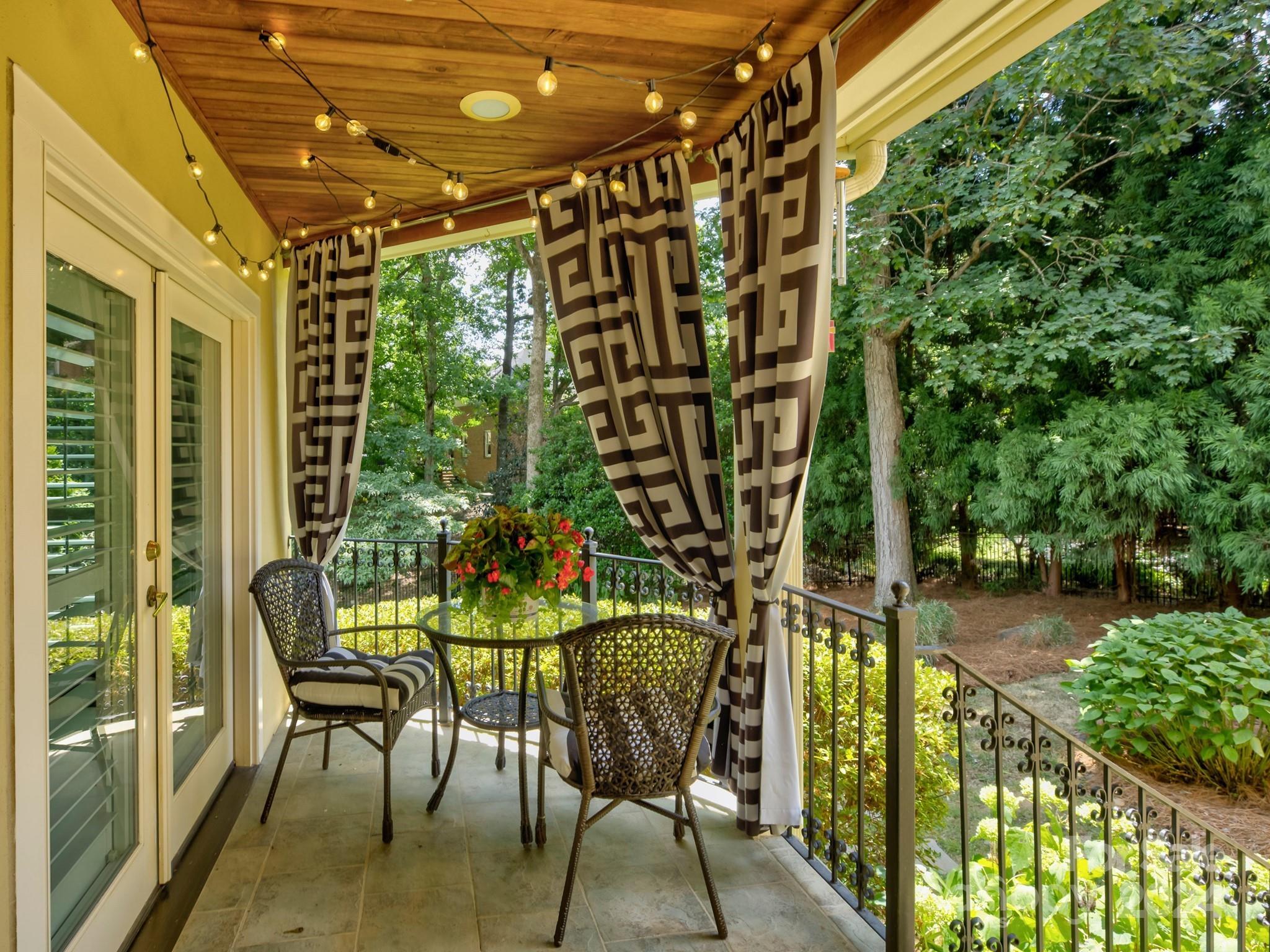 4440 Canoebrook Road Charlotte, NC 28210 - Photo 40 of 47 a patio with glass top table and chairs