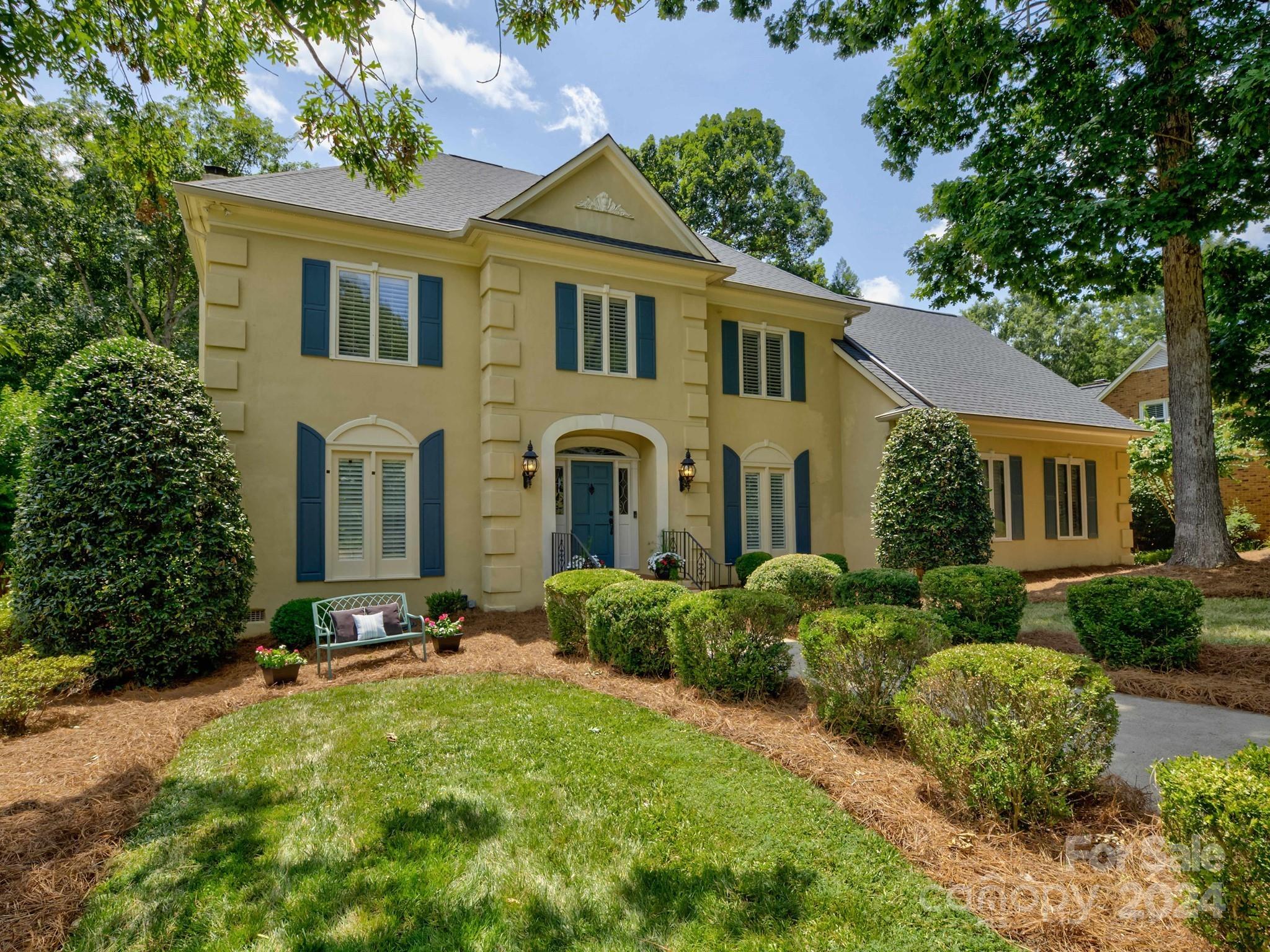4440 Canoebrook Road Charlotte, NC 28210 - Photo 4 of 47 a front view of a house with a yard