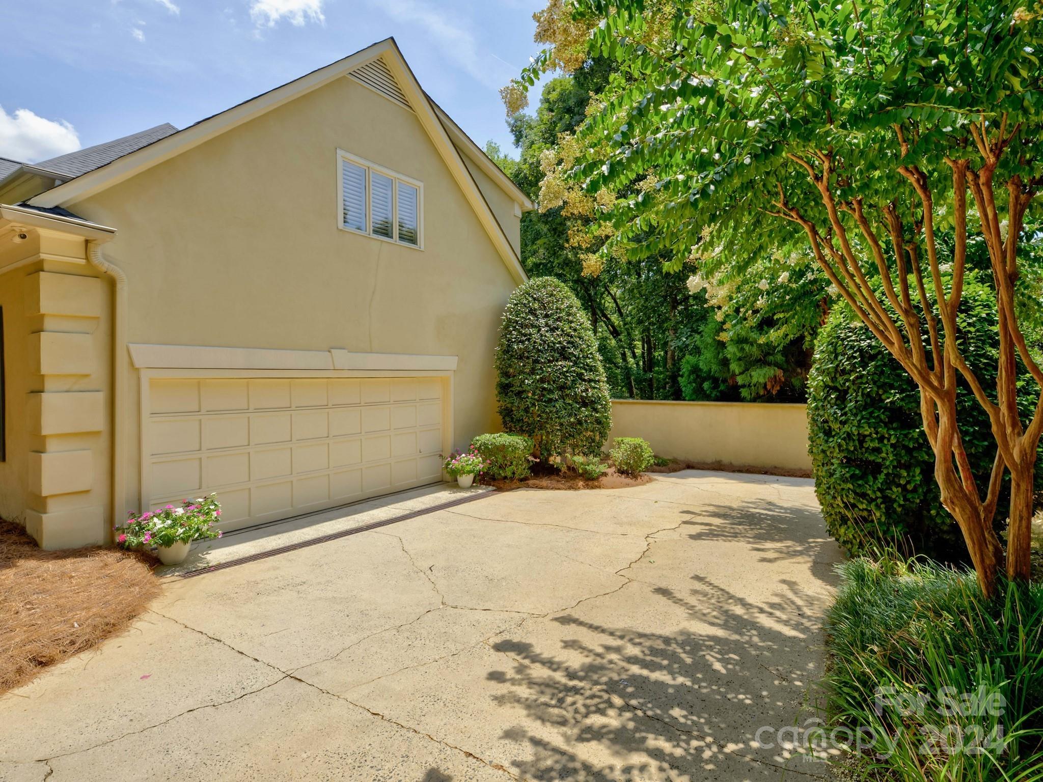 4440 Canoebrook Road Charlotte, NC 28210 - Photo 47 of 47 a front view of a house with a yard and garage