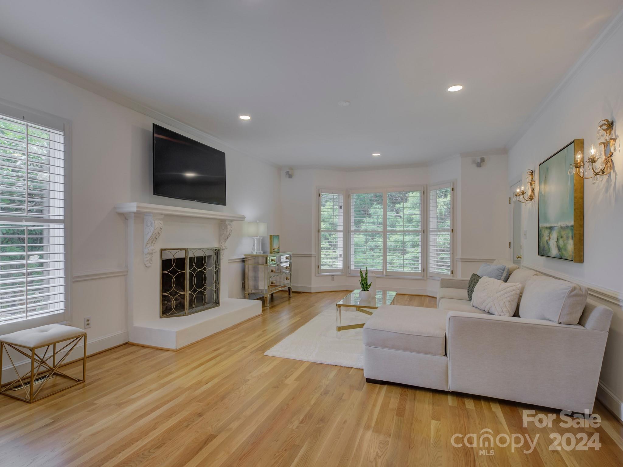 4440 Canoebrook Road Charlotte, NC 28210 - Photo 7 of 47 a living room with furniture and a fireplace