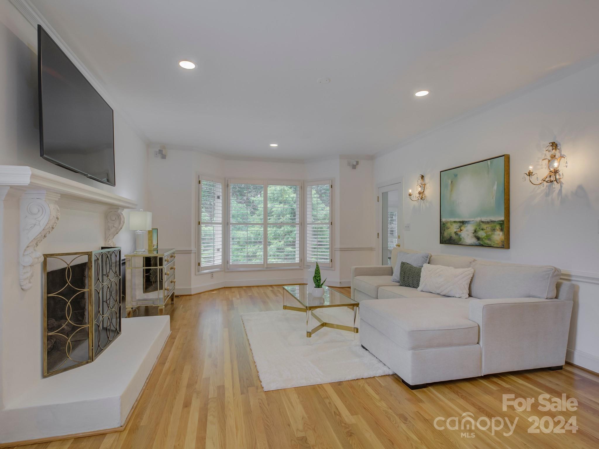 4440 Canoebrook Road Charlotte, NC 28210 - Photo 8 of 47 a living room with furniture fireplace and flat screen tv