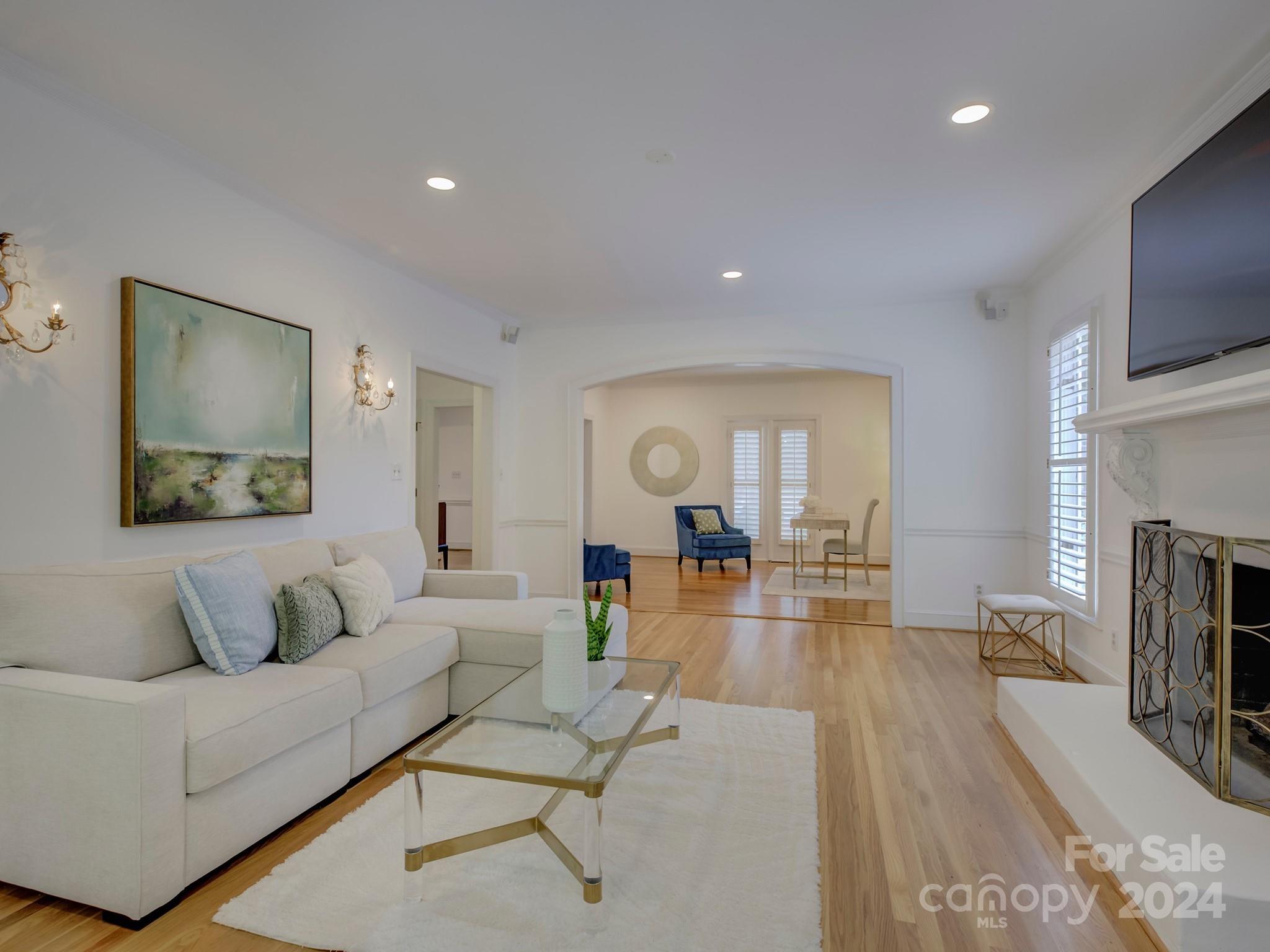 4440 Canoebrook Road Charlotte, NC 28210 - Photo 9 of 47 a living room with fireplace furniture and a flat screen tv