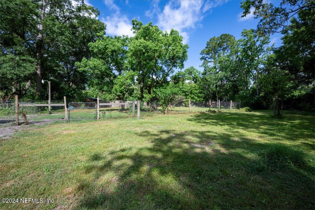 4847 Reed Avenue Jacksonville, FL 32257 - Photo 29 of 36 a view of outdoor space with deck and yard