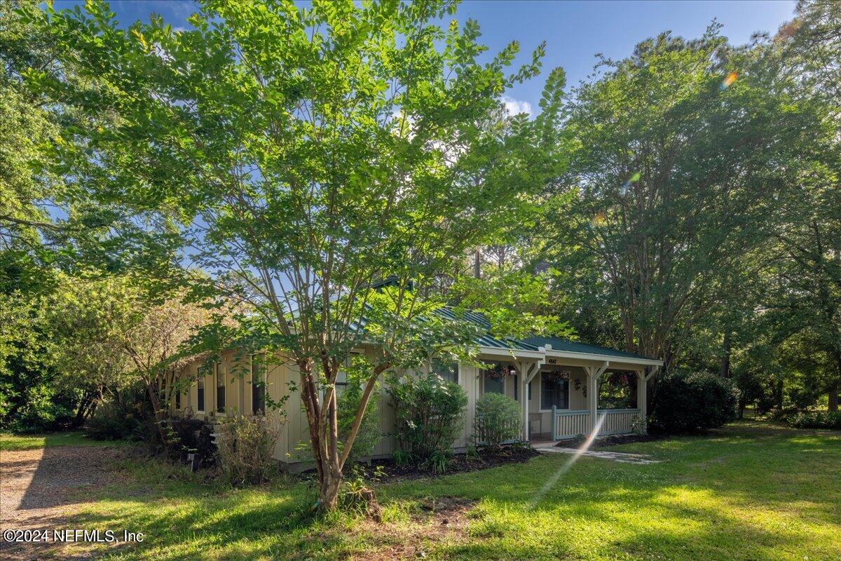 4847 Reed Avenue Jacksonville, FL 32257 - Photo 35 of 36 a view of house with backyard outdoor seating and lake