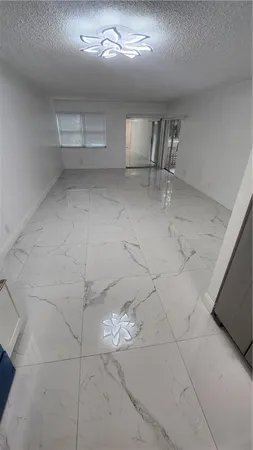 a view of empty room with windows