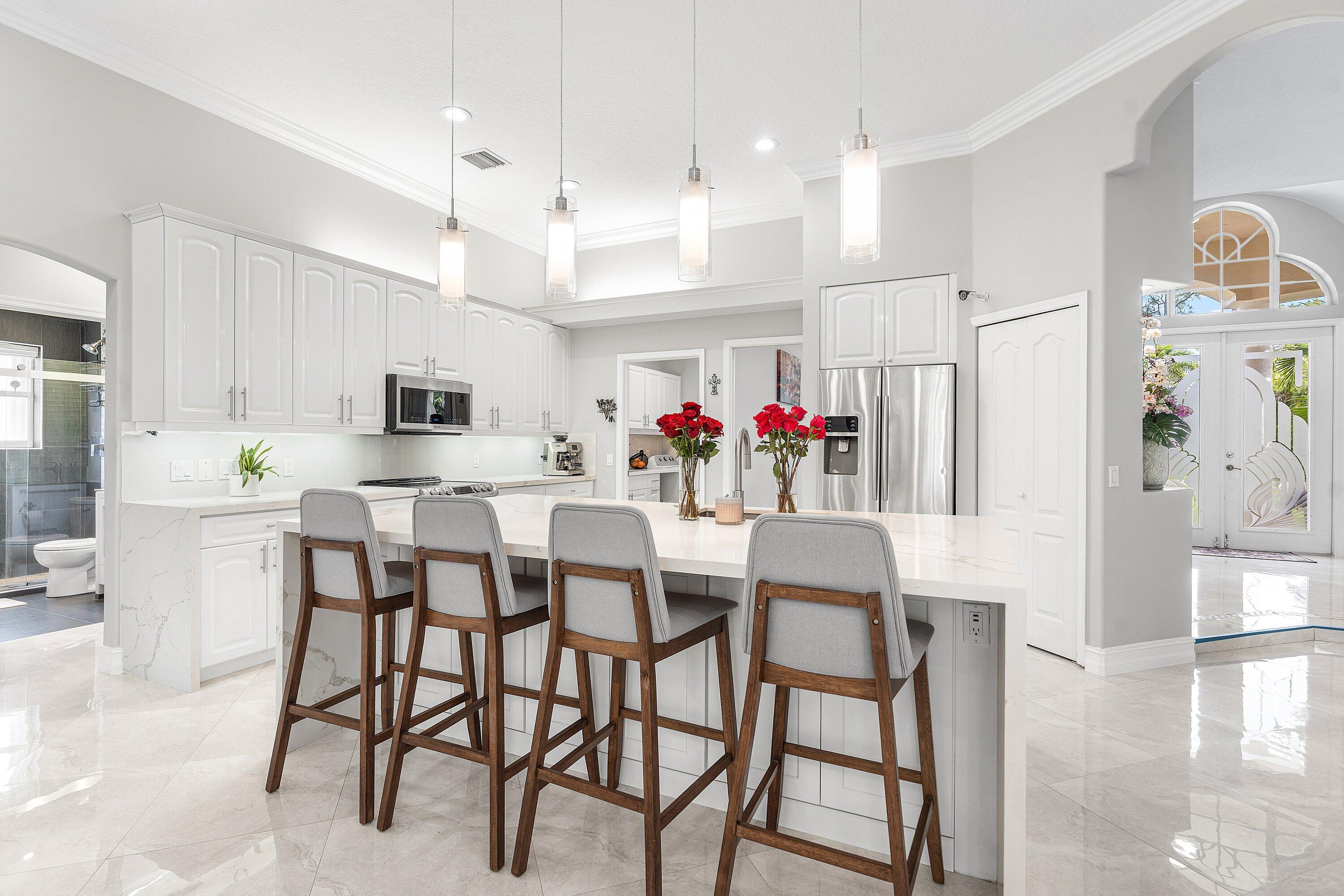 12328 85th Road North West Palm Beach, FL 33412 - Photo 17 of 51 a view of a dining room with furniture and wooden floor