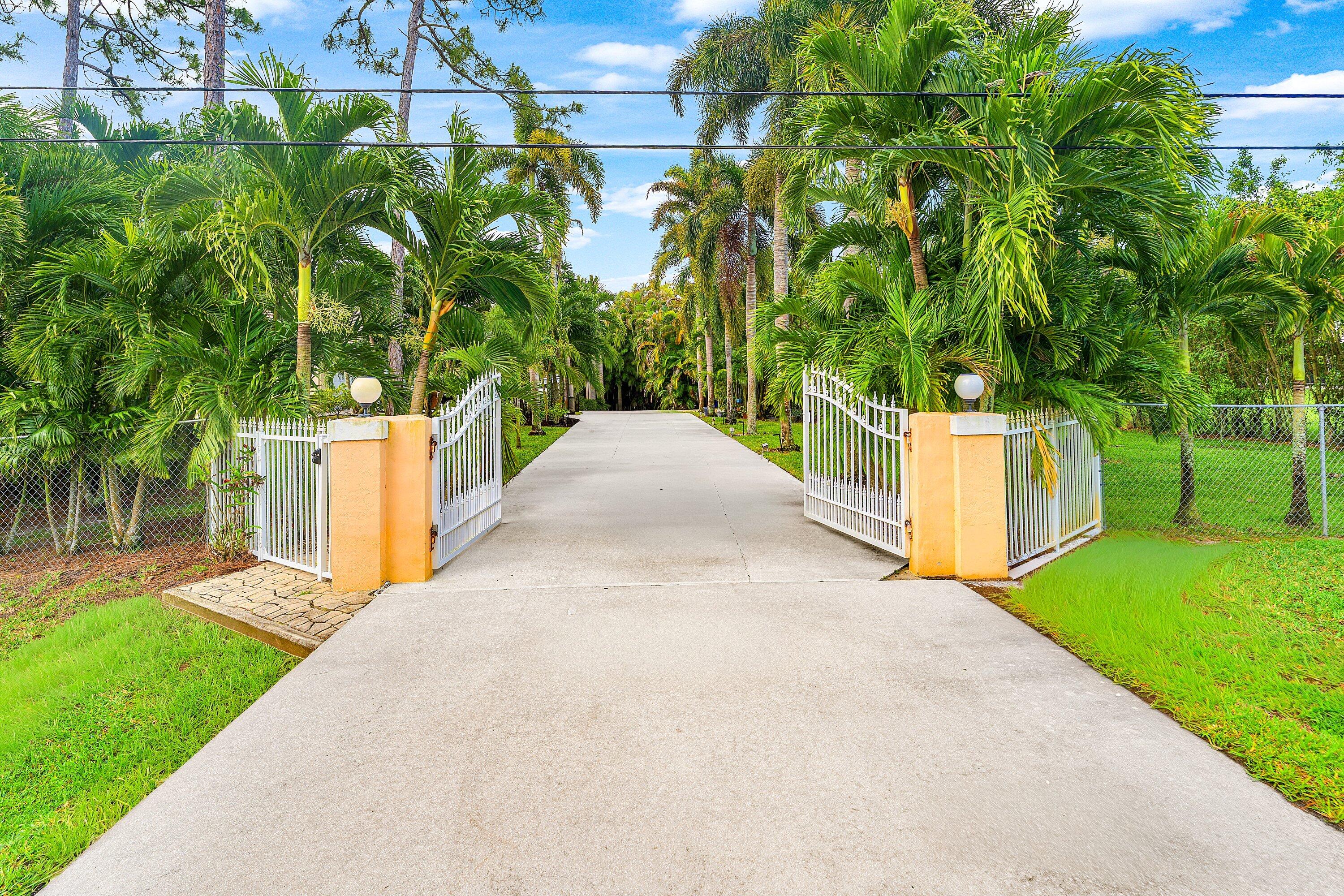 12328 85th Road North West Palm Beach, FL 33412 - Photo 2 of 51 Front gate
