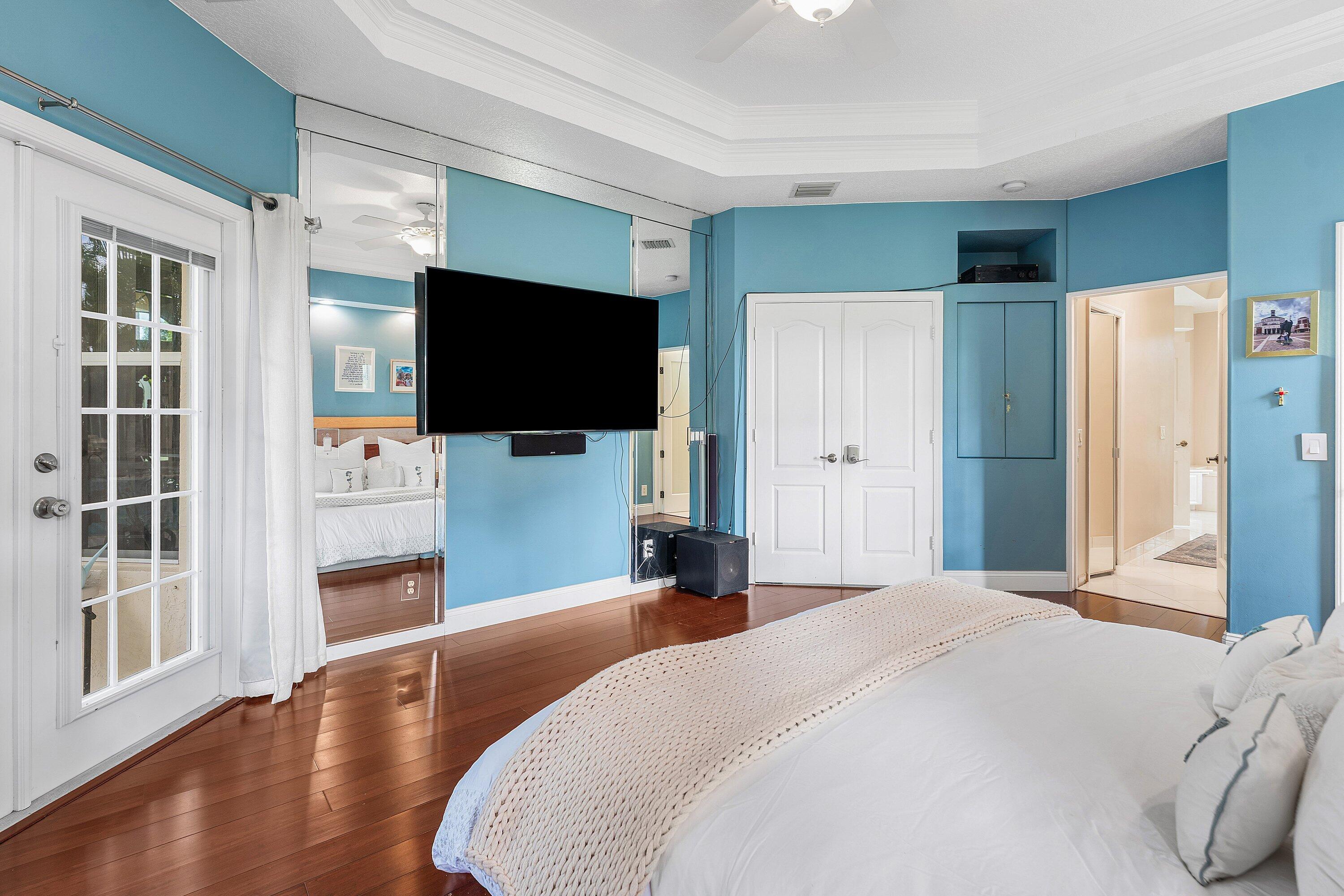 12328 85th Road North West Palm Beach, FL 33412 - Photo 23 of 51 a bedroom with a flat screen tv and a bed
