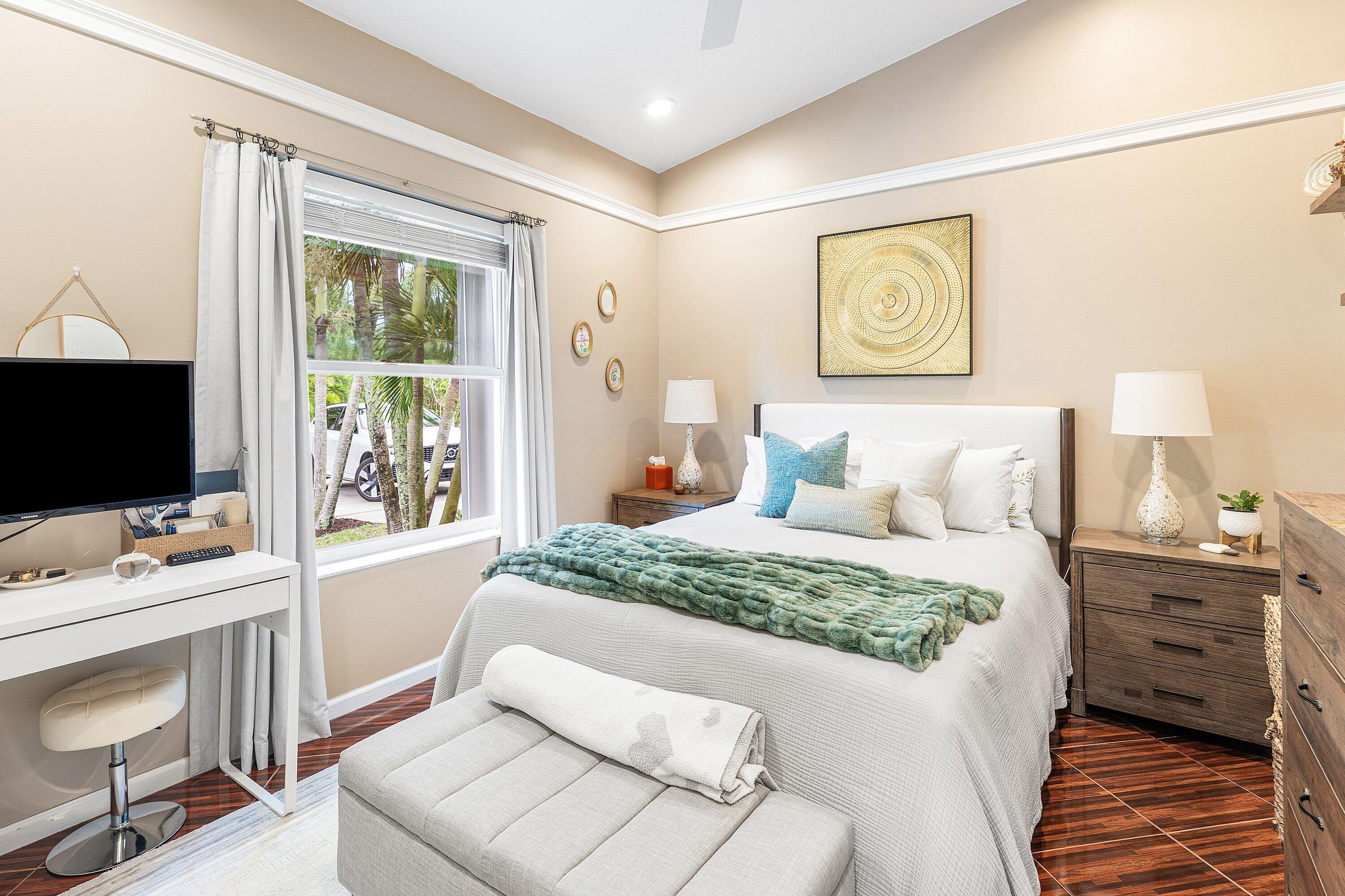 12328 85th Road North West Palm Beach, FL 33412 - Photo 33 of 51 a bedroom with a bed and a flat screen tv