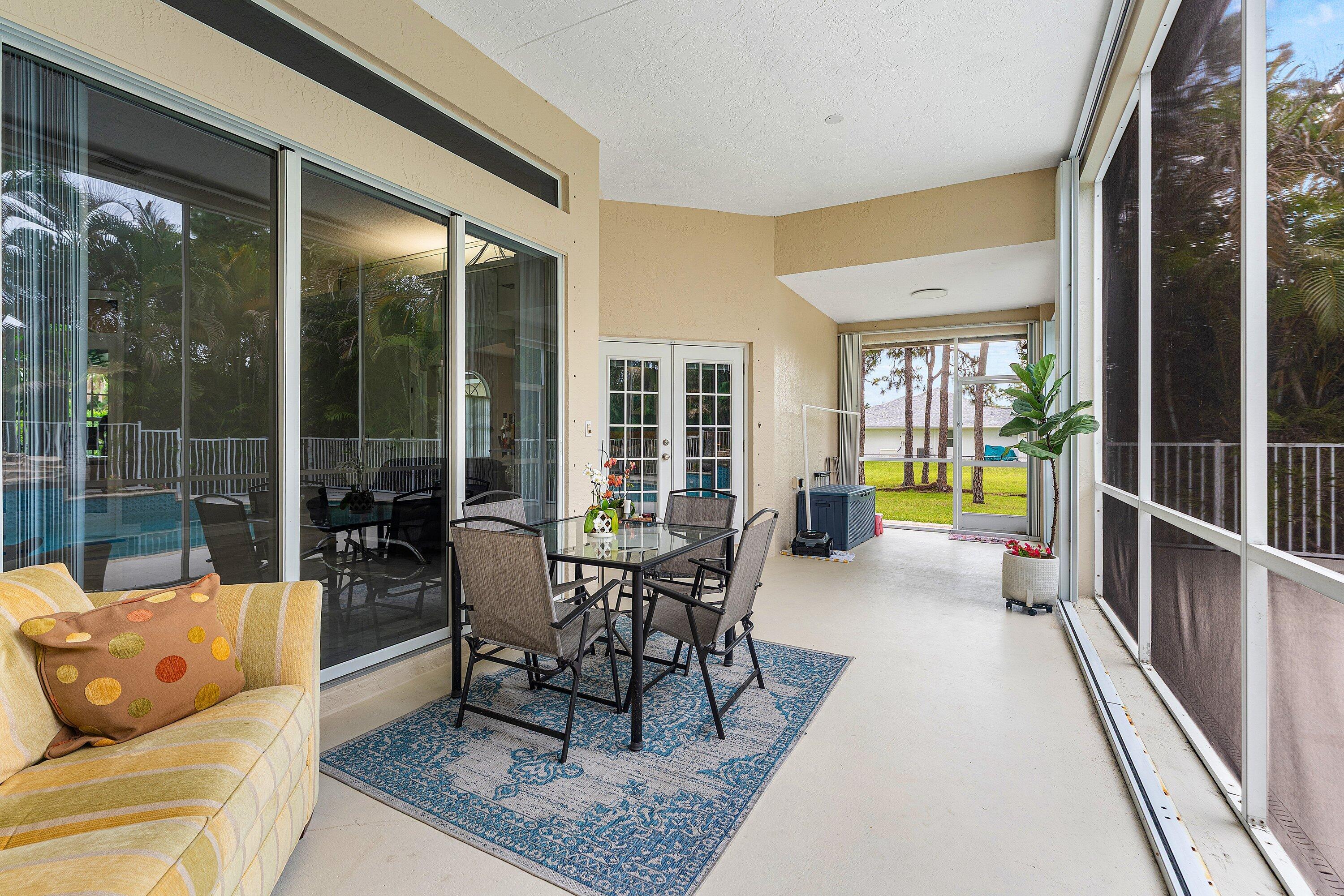12328 85th Road North West Palm Beach, FL 33412 - Photo 34 of 51 Back screen-in porch