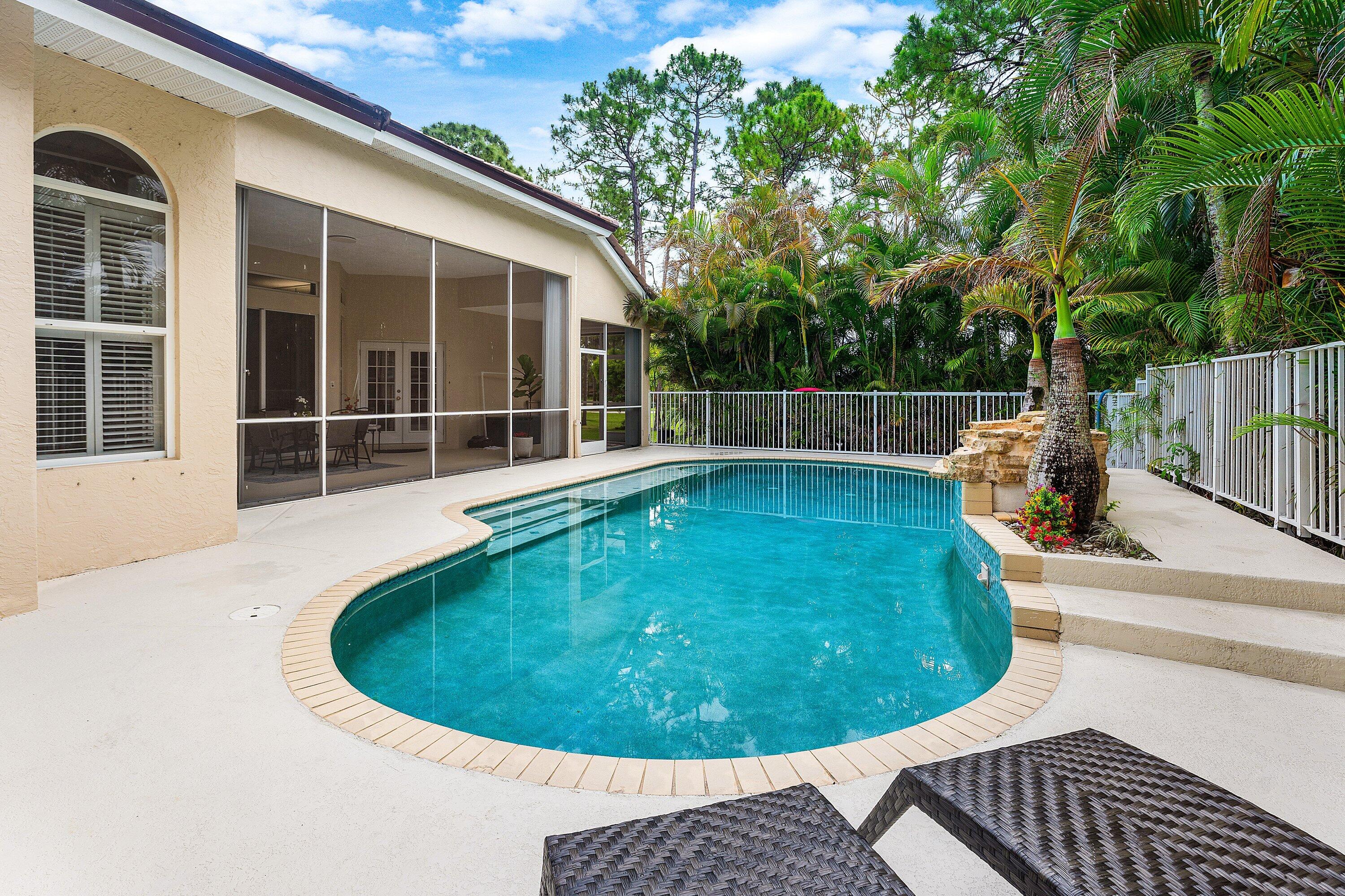 12328 85th Road North West Palm Beach, FL 33412 - Photo 37 of 51 a view of a swimming pool with a outdoor seating