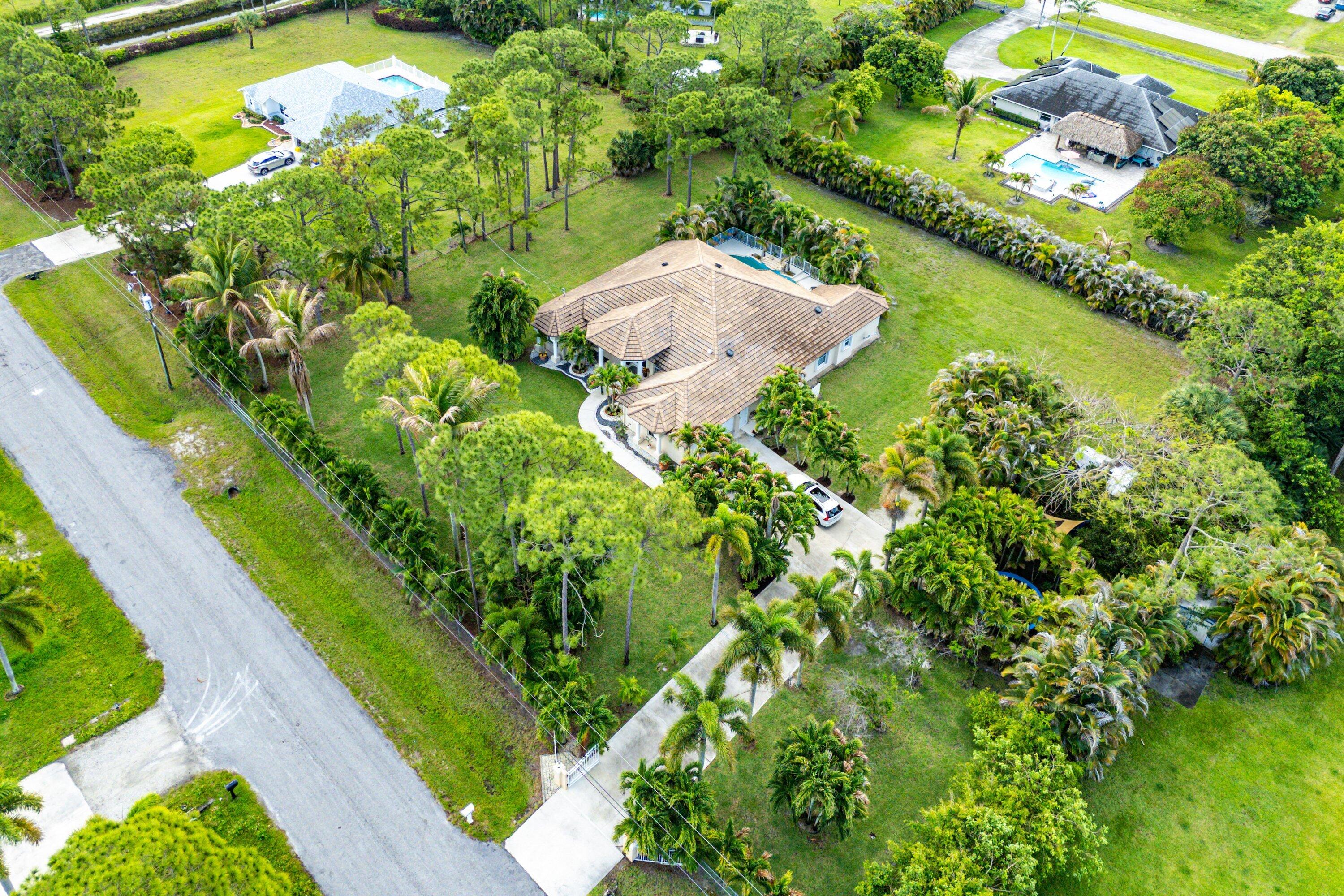 12328 85th Road North West Palm Beach, FL 33412 - Photo 46 of 51 a view of a lake with a flower