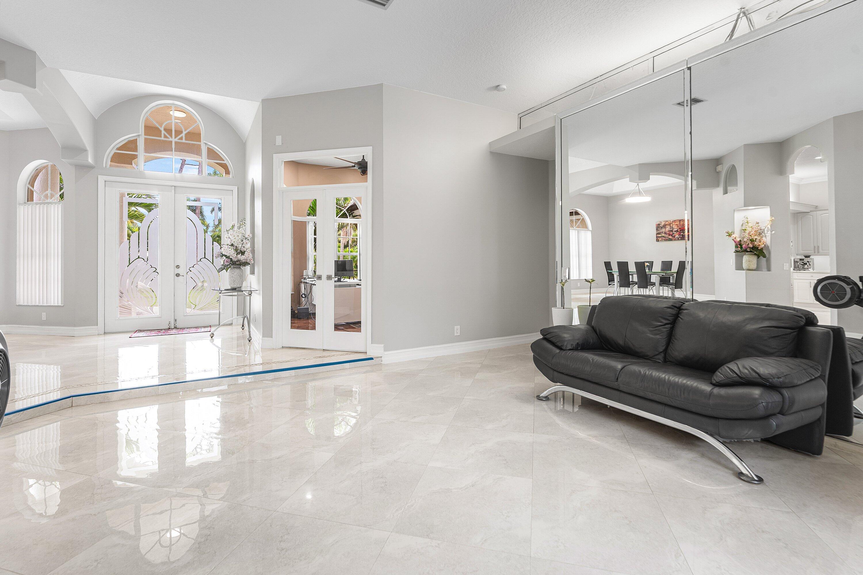 12328 85th Road North West Palm Beach, FL 33412 - Photo 10 of 51 a living room with furniture and a large window