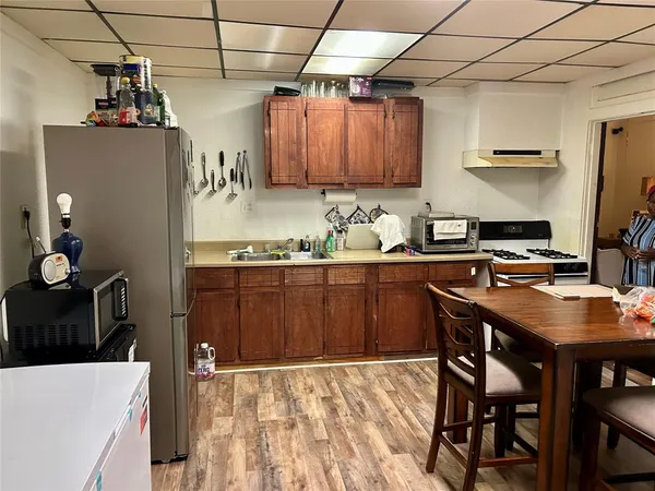 a kitchen with a table and chairs in it