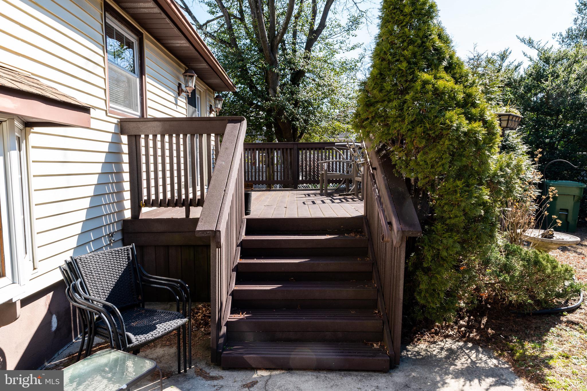901 Haddonfield-Berlin Road Cherry Hill, NJ 08034 - Photo 4 of 26 a view of a patio with chair and tables