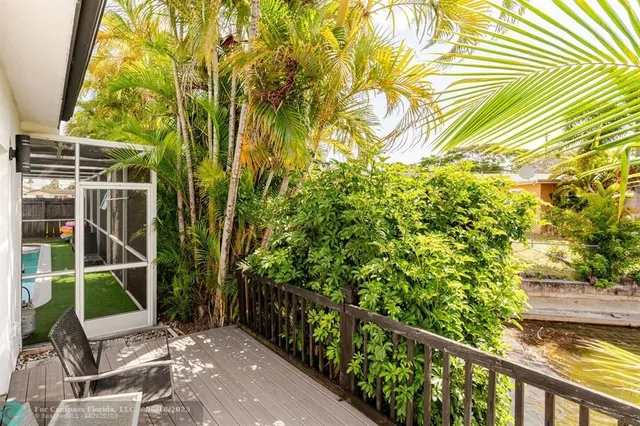 a view of a chair and table in the balcony