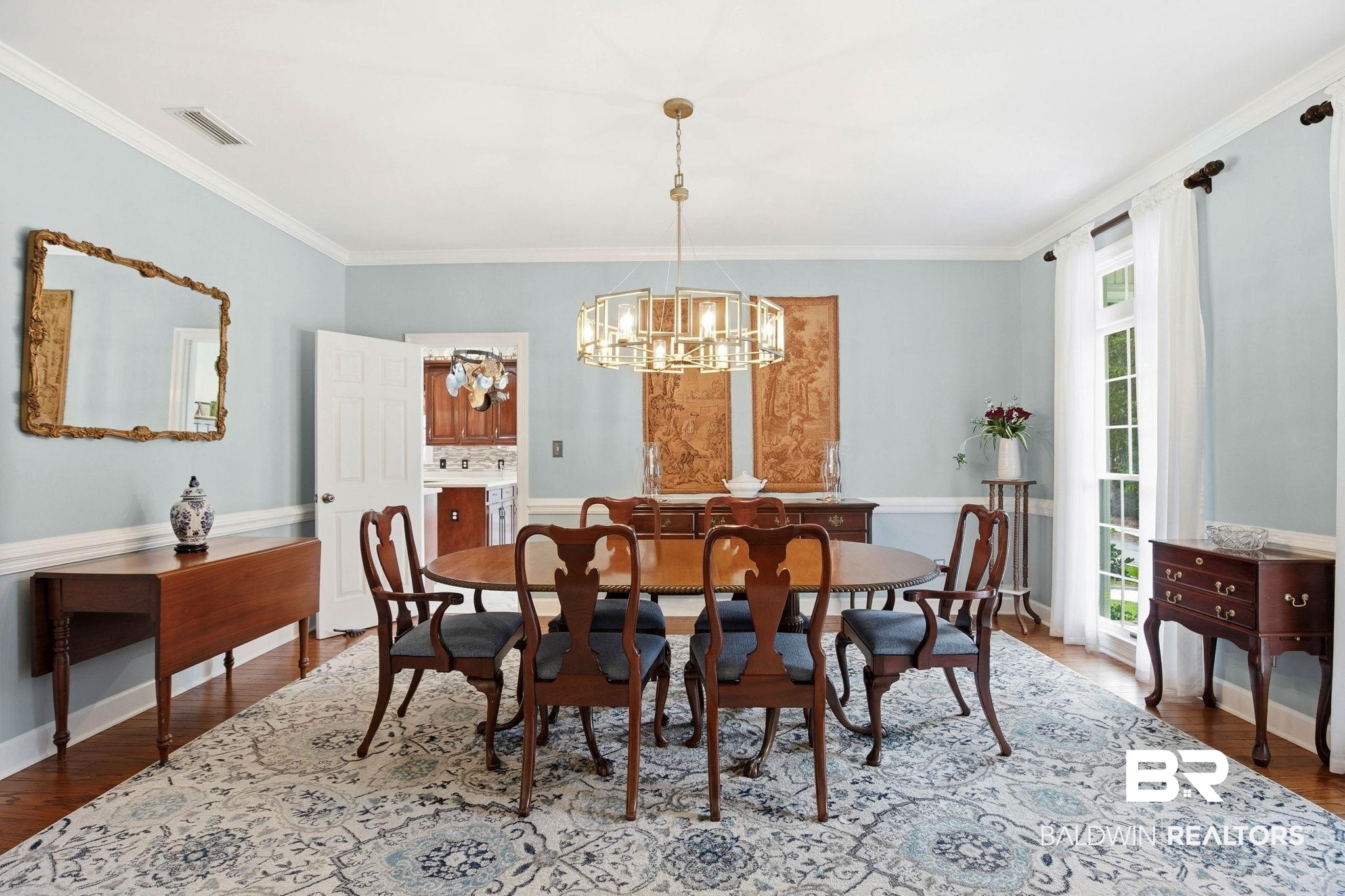31515 Rhett Drive Spanish Fort, AL 36527 - Photo 12 of 100 The dining room measures 13' 1" x 16' 7" and has crown molding, lots of natural light and a beautiful chandelier.