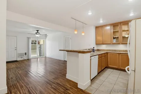 a kitchen with a refrigerator and window