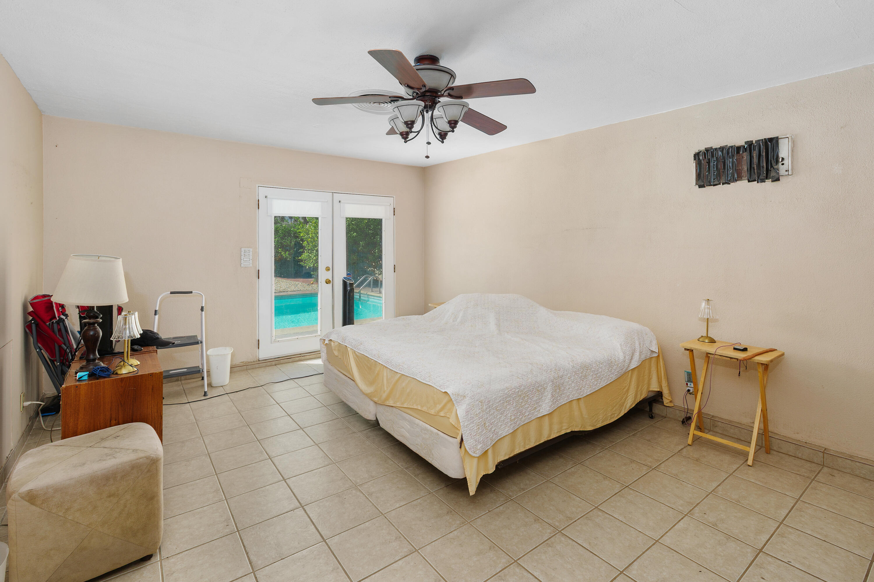 1077 South Riverside Drive Palm Springs, CA 92264 - Photo 25 of 35 a bedroom with a bed and window